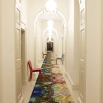 narrow hallway colorful rug